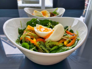 Seaweed salad with salmon spinach and boiled egg